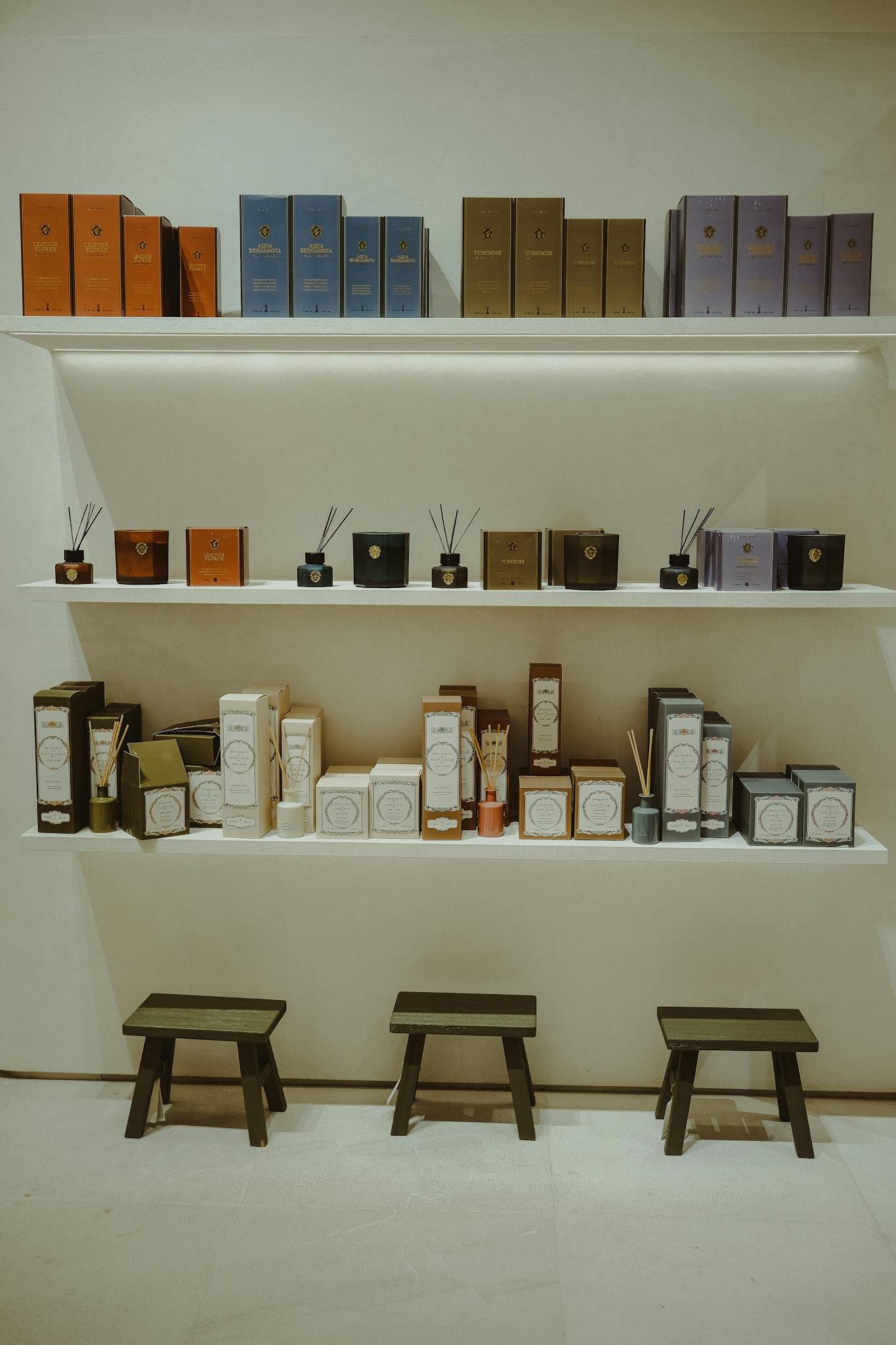 Two shelves with elegantly displayed luxury merchandise, offering ample copy space.